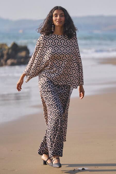 Dash And Dot Black Cotton Boat Neck High-low Hem Printed Top And Pant Co-ord Set at Aza Fashions Dash And Dot_Black Cotton Boat Neck High-low Hem Printed Top And Pant Co-ord Set _at_Aza_Fashions