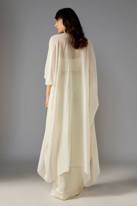 Shop Maisolos Ivory Modal, Satin Sequins, Beads Sweetheart Embellished Cape Slit Skirt Set at Aza Fashions Shop_Maisolos_Ivory Modal, Satin Sequins, Beads Sweetheart Embellished Cape Slit Skirt Set_at_Aza_Fashions