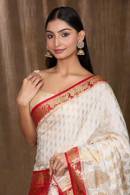 Shop Naintara Bajaj White Satin, Silk Zari, Floral And Woven Pattern Saree With Running Blouse Online at Aza Fashions Shop_Naintara Bajaj_White Satin, Silk Zari, Floral And Woven Pattern Saree With Running Blouse _Online_at_Aza_Fashions
