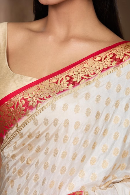 Naintara Bajaj White Satin, Silk Zari, Floral And Woven Pattern Saree With Running Blouse at Aza Fashions Naintara Bajaj_White Satin, Silk Zari, Floral And Woven Pattern Saree With Running Blouse _at_Aza_Fashions