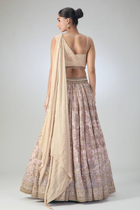 Shop Tarun Tahiliani Peach Embroidery, Stones Asymmetric Floral Lehenga And Draped Blouse Set at Aza Fashions Shop_Tarun Tahiliani_Peach Embroidery, Stones Asymmetric Floral Lehenga And Draped Blouse Set_at_Aza_Fashions