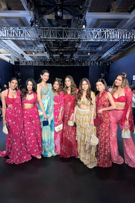 Awigna_Magenta Sweetheart Neck Bloomy Print Cape And Flared Pant Set_at_Aza_Fashions