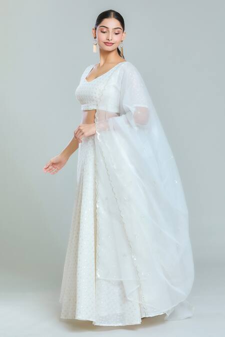 Naintara Bajaj_White Organza, Georgette Sequins Shimmering Snowflake Embroidered Lehenga Set_at_Aza_Fashions