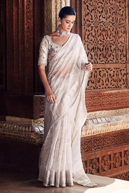 Matsya Ivory Tissue Tassels, Beads Polo Collar Nandi Hand Embroidered Saree With Blouse at Aza Fashions Matsya_Ivory Tissue Tassels, Beads Polo Collar Nandi Hand Embroidered Saree With Blouse _at_Aza_Fashions