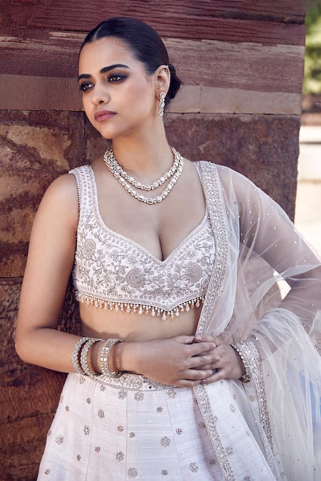 Shop_Matsya_Ivory Silk, Net Pearls, Sequins, Royal Nandi Raw Embroidered Bridal Lehenga Set _Online_at_Aza_Fashions