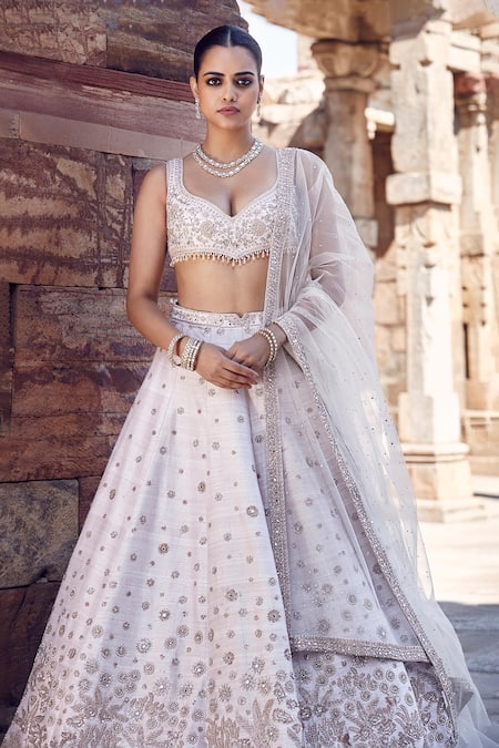 Matsya_Ivory Silk, Net Pearls, Sequins, Royal Nandi Raw Embroidered Bridal Lehenga Set _at_Aza_Fashions