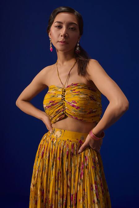 Shop ZeN'S Couture Yellow Crepe Embroidery Halter Neck Mahnoor Floral Print Pleated Lehenga Set at Aza Fashions Shop_ZeN'S Couture_Yellow Crepe Embroidery Halter Neck Mahnoor Floral Print Pleated Lehenga Set_at_Aza_Fashions