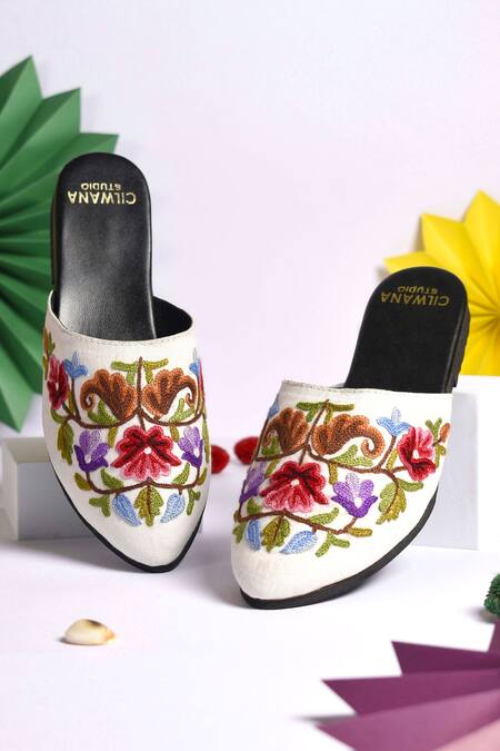 Shop Cilwana Studio White Floral And Aari Embroidered Mules at Aza Fashions Shop_Cilwana Studio_White Floral And Aari Embroidered Mules_at_Aza_Fashions