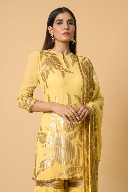 Shop Nakul Sen Yellow Silk Sequins Round Neck Lotus Embroidered Kurta Gharara Set Online at Aza Fashions Shop_Nakul Sen_Yellow Silk Sequins Round Neck Lotus Embroidered Kurta Gharara Set _Online_at_Aza_Fashions