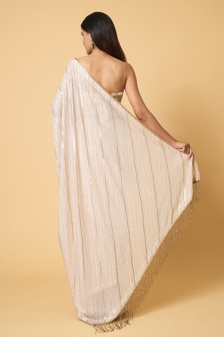 Shop Nakul Sen Ivory Silk, Chiffon Sequins Diagonal Saree With Unstitched Bouse Piece at Aza Fashions Shop_Nakul Sen_Ivory Silk, Chiffon Sequins Diagonal Saree With Unstitched Bouse Piece _at_Aza_Fashions