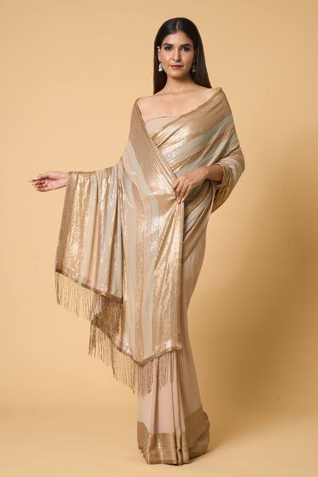 Nakul Sen Beige Silk, Chiffon Sequins Striped Saree With Unstitched Blouse Piece at Aza Fashions Nakul Sen_Beige Silk, Chiffon Sequins Striped Saree With Unstitched Blouse Piece _at_Aza_Fashions