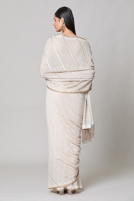 Shop Nakul Sen Ivory Silk, Chiffon Sequins V-neck Saree With Embroidered Blouse at Aza Fashions Shop_Nakul Sen_Ivory Silk, Chiffon Sequins V-neck Saree With Embroidered Blouse _at_Aza_Fashions