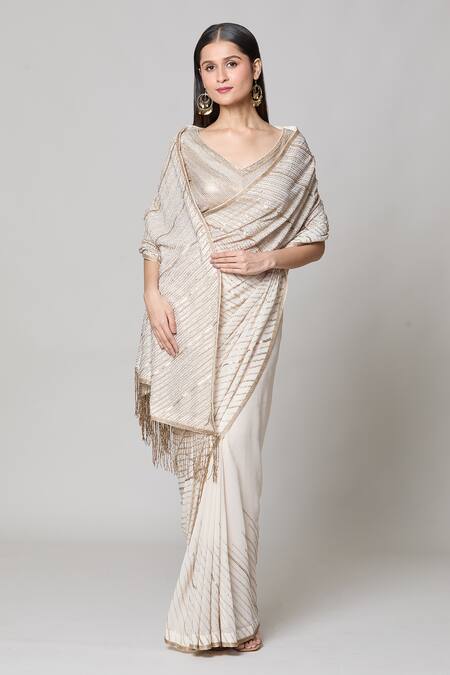 Buy Nakul Sen Ivory Silk, Chiffon Sequins V-neck Saree With Embroidered Blouse Online at Aza Fashions Buy_Nakul Sen_Ivory Silk, Chiffon Sequins V-neck Saree With Embroidered Blouse _Online_at_Aza_Fashions