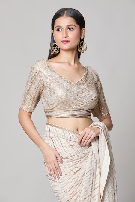 Nakul Sen Ivory Silk, Chiffon Sequins V-neck Saree With Embroidered Blouse at Aza Fashions Nakul Sen_Ivory Silk, Chiffon Sequins V-neck Saree With Embroidered Blouse _at_Aza_Fashions
