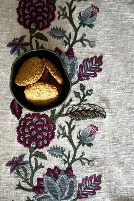 House Of Inari Wine 100% Cotton Floral, Tassels Work Table Runner at Aza Fashions House Of Inari_Wine 100% Cotton Floral, Tassels Work Table Runner_at_Aza_Fashions