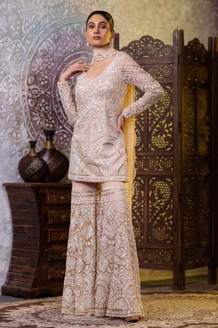 Shop_Raj Arora_Cream Net Sequins, Zari, Cut Work V-neck Embroidered Short Kurta Gharara Set _Online_at_Aza_Fashions