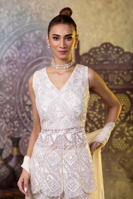 Raj Arora_Ivory Net Sequins V-neck Embroidered Peplum Top Bell Bottom Pant Set _at_Aza_Fashions