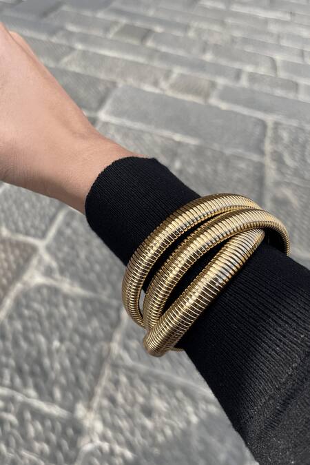 The Jewel Factor Gold Plated Cut Work Greek Goddess Bangle Online at Aza Fashions The Jewel Factor_Gold Plated Cut Work Greek Goddess Bangle_Online_at_Aza_Fashions