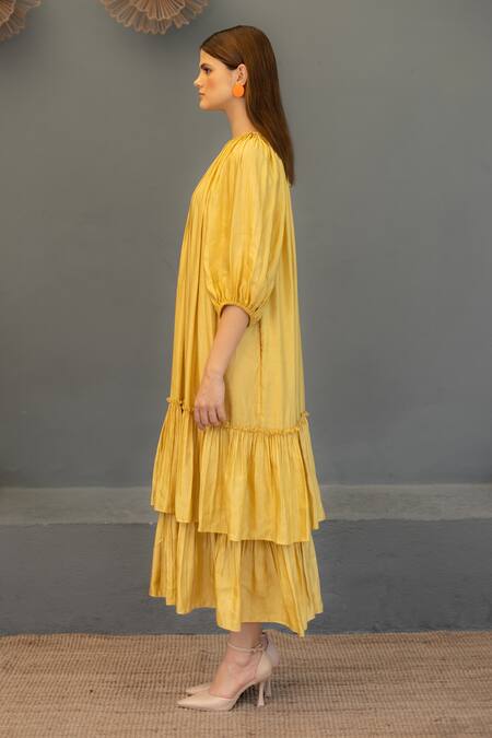 Buy Ozel Yellow Linen Satin Plain Round Ariana Tiered Gathered Midi Dress Online at Aza Fashions Buy_Ozel_Yellow Linen Satin Plain Round Ariana Tiered Gathered Midi Dress _Online_at_Aza_Fashions