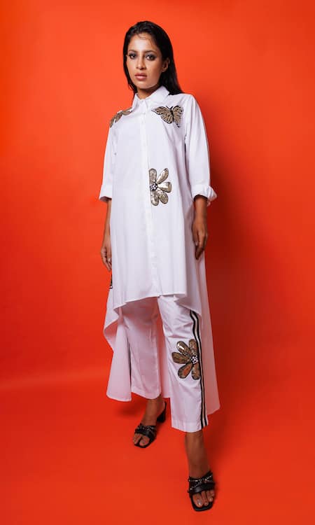 Shop Richaa Goenka White Cotton Sequins, Embroidery Collared Asymmetric Kurta With Pant at Aza Fashions Shop_Richaa Goenka_White Cotton Sequins, Embroidery Collared Asymmetric Kurta With Pant _at_Aza_Fashions