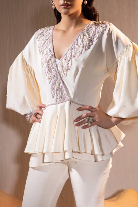 Tyohar Ivory Crepe Embroidery Sequin V Neck Mahra Pearl Peplum Top With Bootcut Pant at Aza Fashions Tyohar_Ivory Crepe Embroidery Sequin V Neck Mahra Pearl Peplum Top With Bootcut Pant_at_Aza_Fashions