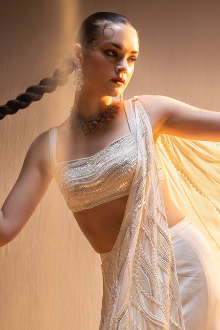 Buy Tyohar Ivory Crepe Sequins, Pearls, Cut Nour Phoenix Embroidered Pre-draped Saree Set Buy_Tyohar_Ivory Crepe Sequins, Pearls, Cut Nour Phoenix Embroidered Pre-draped Saree Set