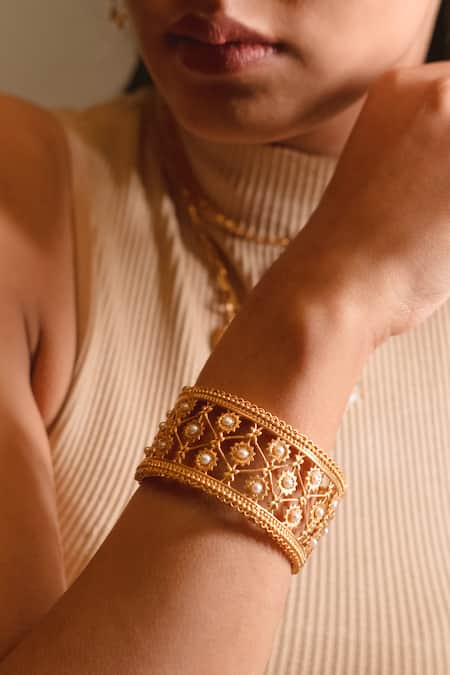 Shop Ruuh Studios Gold Plated Pearls Freshwater Embellished Bangle at Aza Fashions Shop_Ruuh Studios_Gold Plated Pearls Freshwater Embellished Bangle _at_Aza_Fashions