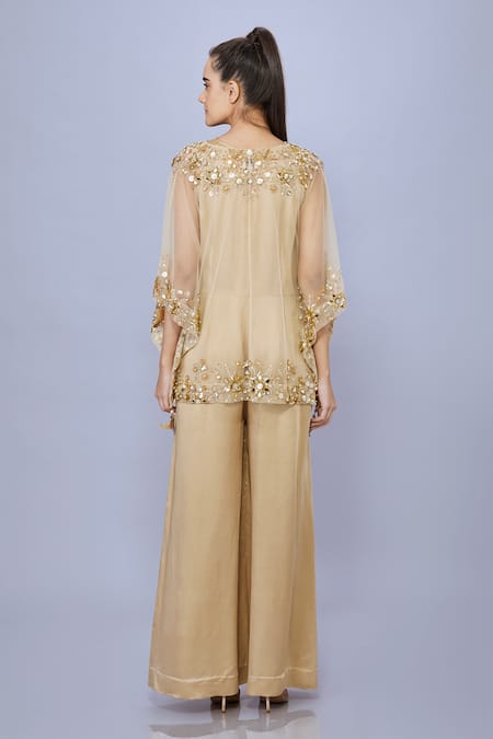Shop Dilnaz Gold Net Hand Embroidered Sequin Kaftan Plung V Snowflake With Jumpsuit at Aza Fashions Shop_Dilnaz_Gold Net Hand Embroidered Sequin Kaftan Plung V Snowflake With Jumpsuit_at_Aza_Fashions