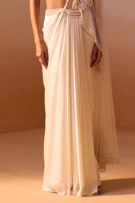 Nitika Gujral Ivory Satin, Net Pearls Rosette Embroidered Pre-draped Saree With Bustier Online at Aza Fashions Nitika Gujral_Ivory Satin, Net Pearls Rosette Embroidered Pre-draped Saree With Bustier _Online_at_Aza_Fashions