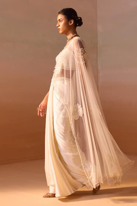 Nitika Gujral Ivory Satin, Net Pearls Rosette Embroidered Pre-draped Saree With Bustier at Aza Fashions Nitika Gujral_Ivory Satin, Net Pearls Rosette Embroidered Pre-draped Saree With Bustier _at_Aza_Fashions