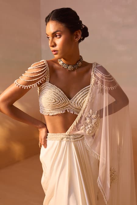 Buy Nitika Gujral Ivory Satin, Net Pearls Rosette Embroidered Pre-draped Saree With Bustier Buy_Nitika Gujral_Ivory Satin, Net Pearls Rosette Embroidered Pre-draped Saree With Bustier
