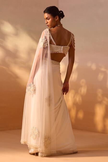 Shop Nitika Gujral Ivory Satin, Net Pearls Rosette Embroidered Pre-draped Saree With Bustier Shop_Nitika Gujral_Ivory Satin, Net Pearls Rosette Embroidered Pre-draped Saree With Bustier