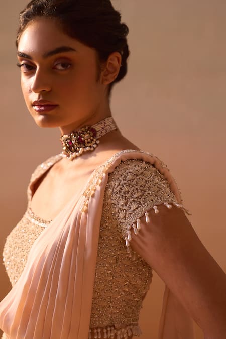 Nitika Gujral_Peach Satin, Net Embroidery, Pearl Embellished Pre-draped Saree With Blouse _at_Aza_Fashions