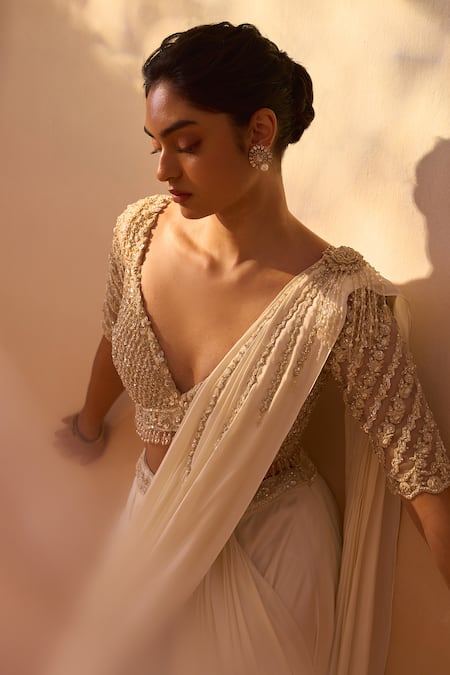 Buy Nitika Gujral Ivory Satin, Net Pearls, Dori Tassel Embellished Pre-draped Saree With Blouse Buy_Nitika Gujral_Ivory Satin, Net Pearls, Dori Tassel Embellished Pre-draped Saree With Blouse