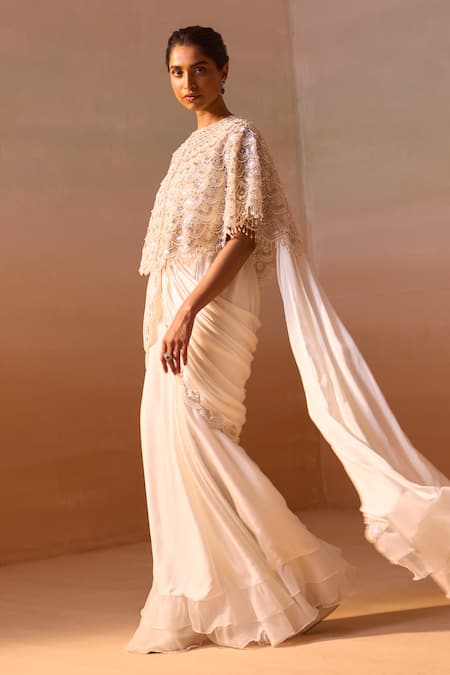 Buy Nitika Gujral White Satin, Organza, Scallop Nalki Zircon Embroidered Cape Pre-draped Saree Set Online at Aza Fashions Buy_Nitika Gujral_White Satin, Organza, Scallop Nalki Zircon Embroidered Cape Pre-draped Saree Set _Online_at_Aza_Fashions