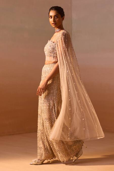 Shop_Nitika Gujral_Peach Net, Satin Crystals, Pearls, And Embroidered Corset Flared Trouser Set _Online_at_Aza_Fashions