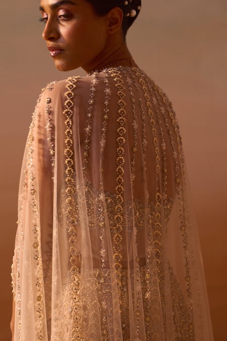 Nitika Gujral_Peach Net, Satin Crystals, Pearls, And Embroidered Corset Flared Trouser Set _at_Aza_Fashions