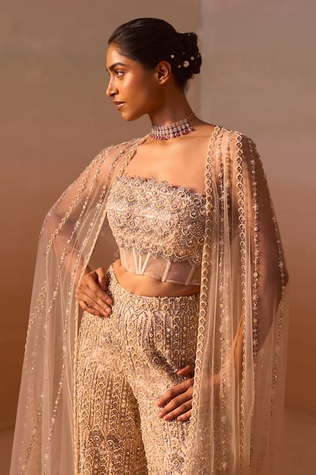 Buy_Nitika Gujral_Peach Net, Satin Crystals, Pearls, And Embroidered Corset Flared Trouser Set 