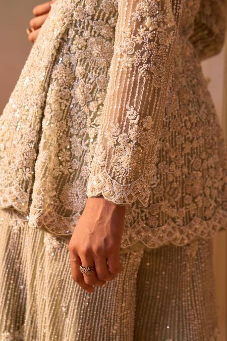 Nitika Gujral Green Net Sequins, Beads, Pearls, Embroidery, Floral Peplum Jacket Sharara Set at Aza Fashions Nitika Gujral_Green Net Sequins, Beads, Pearls, Embroidery, Floral Peplum Jacket Sharara Set _at_Aza_Fashions