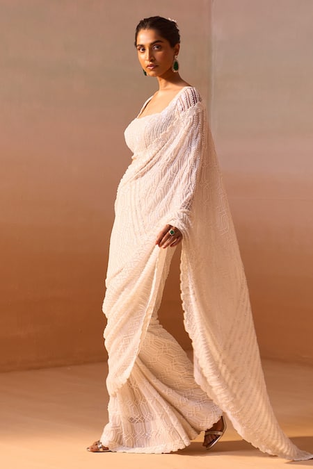 Nitika Gujral_Ivory Georgette, Satin Pearls, Sequins Cutwork Embroidered Saree With Blouse _Online_at_Aza_Fashions