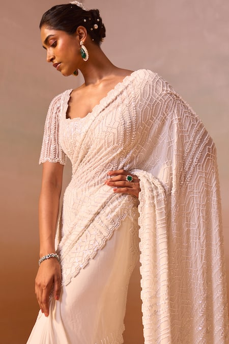 Buy_Nitika Gujral_Ivory Georgette, Satin Pearls, Sequins Cutwork Embroidered Saree With Blouse _Online_at_Aza_Fashions