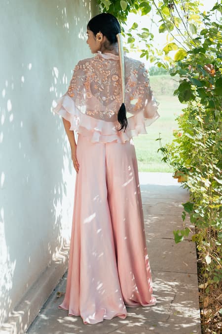 Shop PIRI INDIA Pink Satin, Organza, Crepe Sequins, Beads Dusk Applique Ruffle Cape Palazzo Set at Aza Fashions Shop_PIRI INDIA_Pink Satin, Organza, Crepe Sequins, Beads Dusk Applique Ruffle Cape Palazzo Set _at_Aza_Fashions