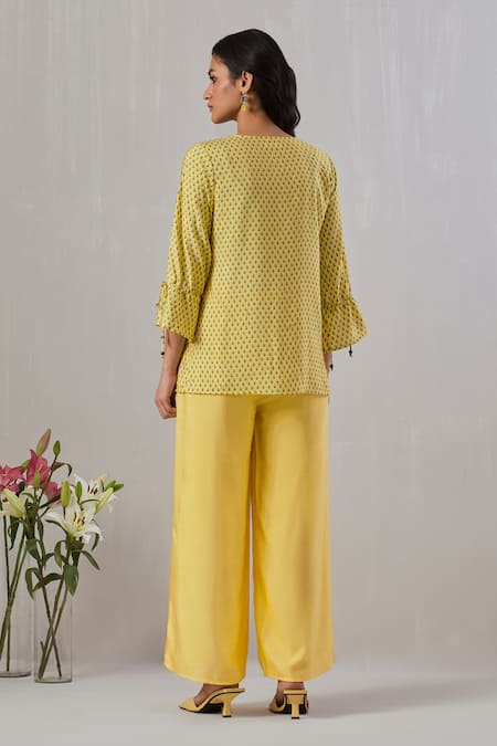 Shop Grass & Sunshine Yellow Viscose Round Neck Flora Spectrum Print Top And Flared Pant Set at Aza Fashions Shop_Grass & Sunshine_Yellow Viscose Round Neck Flora Spectrum Print Top And Flared Pant Set _at_Aza_Fashions