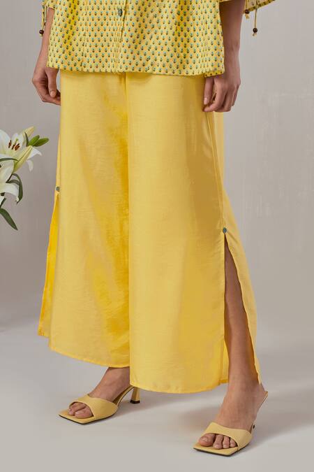 Shop Grass & Sunshine Yellow Viscose Round Neck Flora Spectrum Print Top And Flared Pant Set Online at Aza Fashions Shop_Grass & Sunshine_Yellow Viscose Round Neck Flora Spectrum Print Top And Flared Pant Set _Online_at_Aza_Fashions