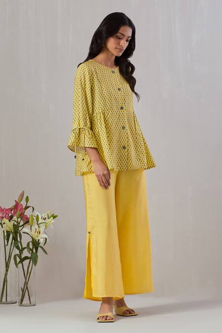 Grass & Sunshine Yellow Viscose Round Neck Flora Spectrum Print Top And Flared Pant Set at Aza Fashions Grass & Sunshine_Yellow Viscose Round Neck Flora Spectrum Print Top And Flared Pant Set _at_Aza_Fashions