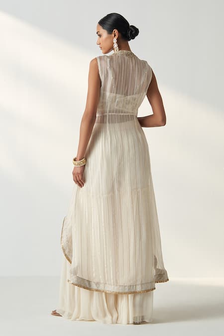 Shop Studio Bagechaa Ivory Organza, Georgette Sequins, Embroidery High Low Cape Gharara Set at Aza Fashions Shop_Studio Bagechaa_Ivory Organza, Georgette Sequins, Embroidery High Low Cape Gharara Set _at_Aza_Fashions