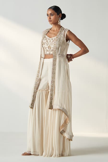 Buy Studio Bagechaa Ivory Organza, Georgette Sequins, Embroidery High Low Cape Gharara Set Online at Aza Fashions Buy_Studio Bagechaa_Ivory Organza, Georgette Sequins, Embroidery High Low Cape Gharara Set _Online_at_Aza_Fashions