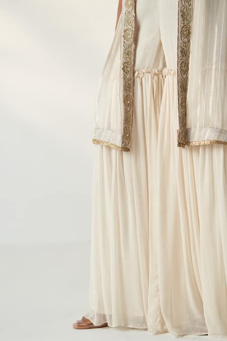 Studio Bagechaa Ivory Organza, Georgette Sequins, Embroidery High Low Cape Gharara Set at Aza Fashions Studio Bagechaa_Ivory Organza, Georgette Sequins, Embroidery High Low Cape Gharara Set _at_Aza_Fashions