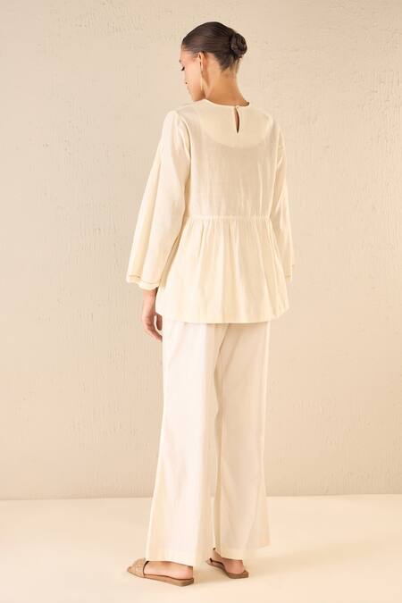 Shop Shivani Bhargava Ivory Cotton Embroidered Thread Round Whispering Roses Tunic Top at Aza Fashions Shop_Shivani Bhargava_Ivory Cotton Embroidered Thread Round Whispering Roses Tunic Top _at_Aza_Fashions