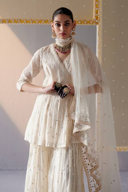 Preevin Off White Cotton, Tulle, Net Mirrors, Embroidery Big Kite Peplum Top Sharara Set Online at Aza Fashions Preevin_Off White Cotton, Tulle, Net Mirrors, Embroidery Big Kite Peplum Top Sharara Set _Online_at_Aza_Fashions